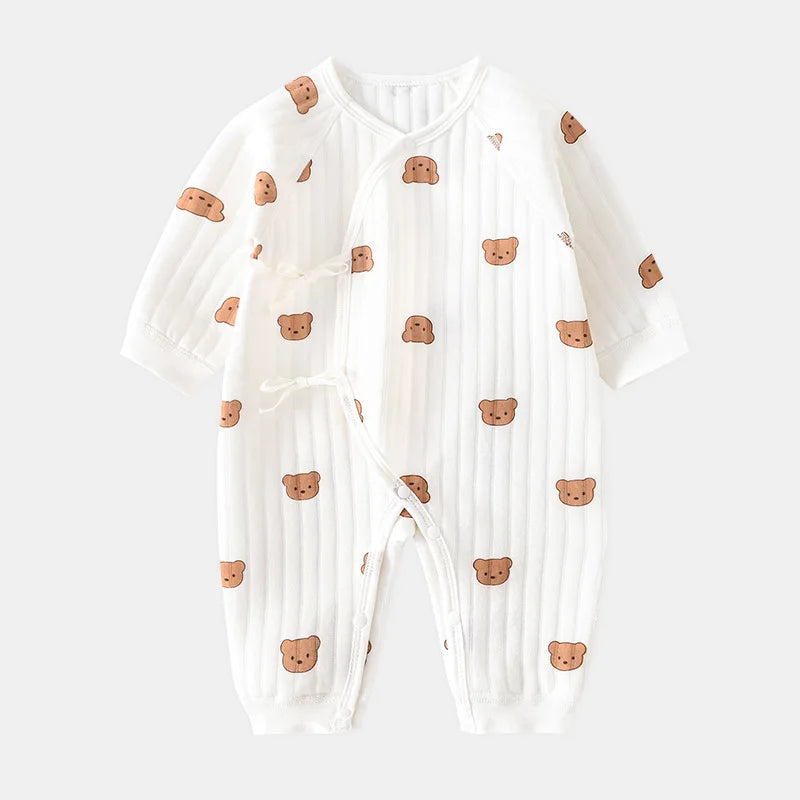 White baby onesie with bear patterns on a white background