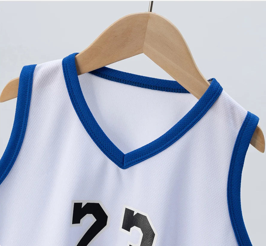 White children's jersey with blue trim on a hanger against a light gray background