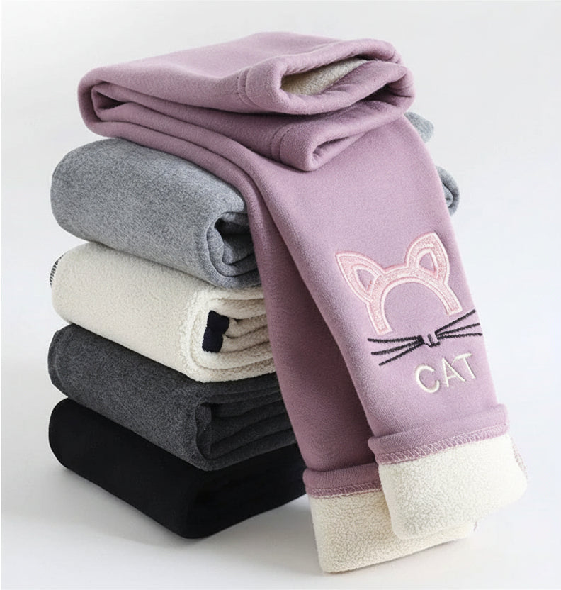 Stack of children's leggings with cat design on a white background