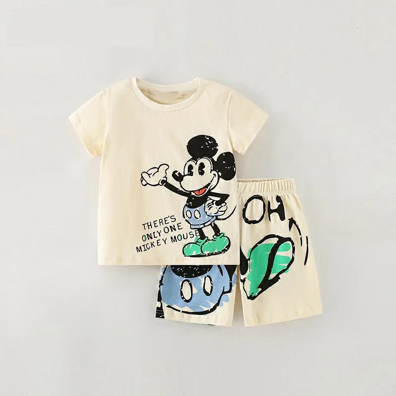 Children's outfit with t-shirt and shorts featuring a cartoon character on a gray background